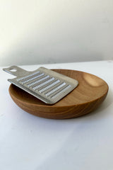 The Wasabi Grater sits atop a bowl against a white backdrop