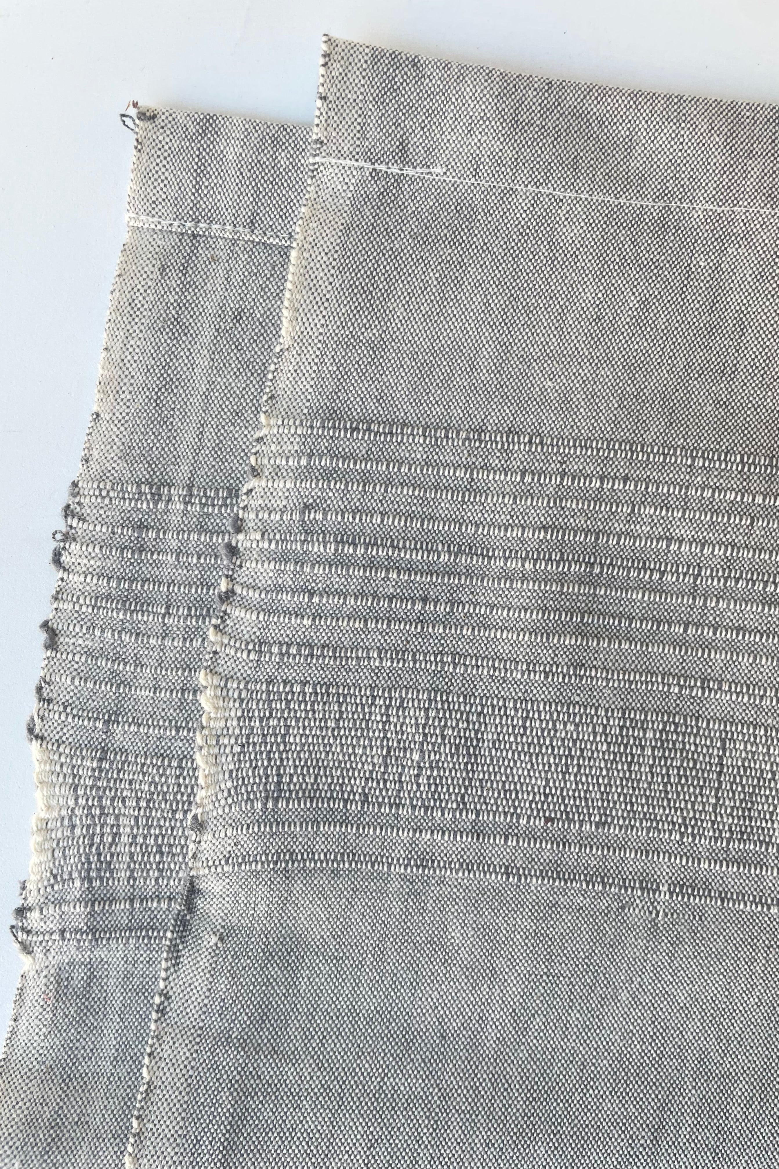 detail of the Tablecloth sea salt large against a white wall