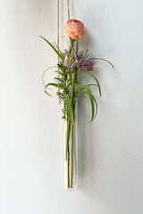 The medium hanging glass vase with cut floral.