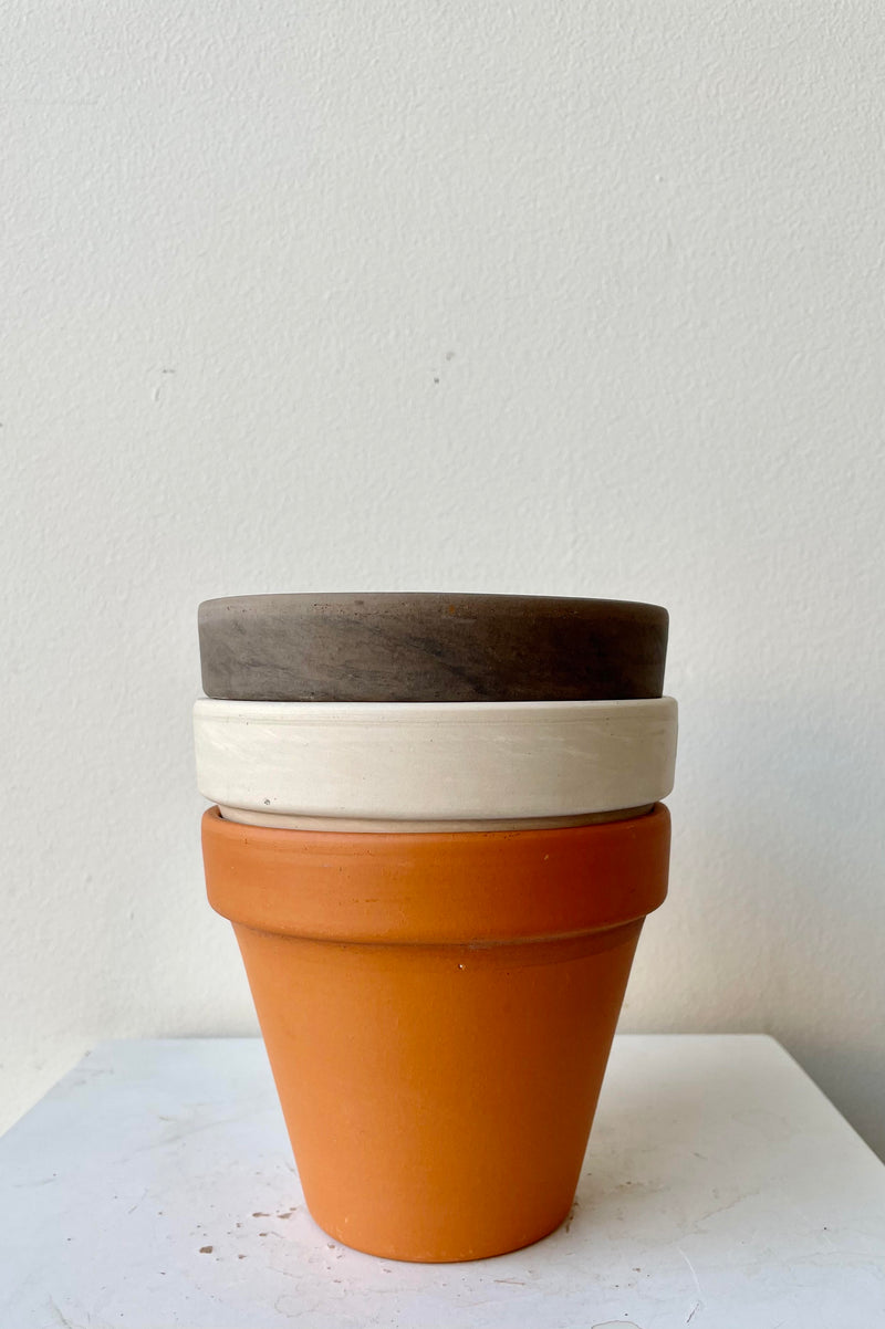 All three of the 4" Clay Pot colors stacked against a white backdrop.