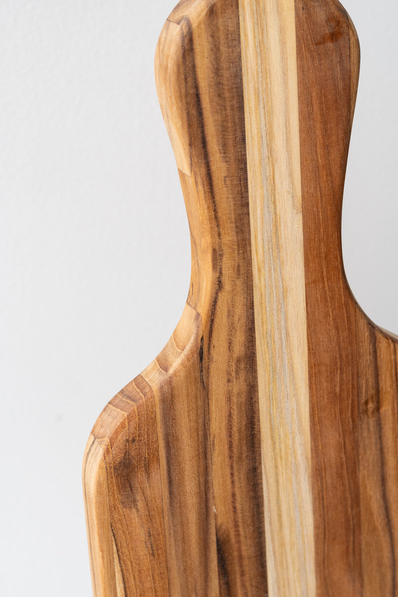 Detail of TeakHaus wood serving board in front of white background