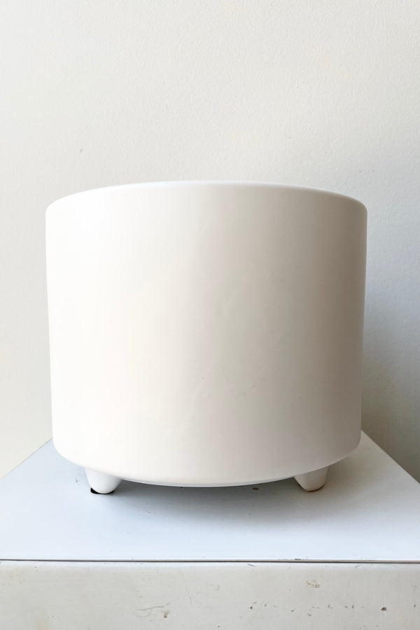The large white Simon footed planter against a white wall at Sprout Home.