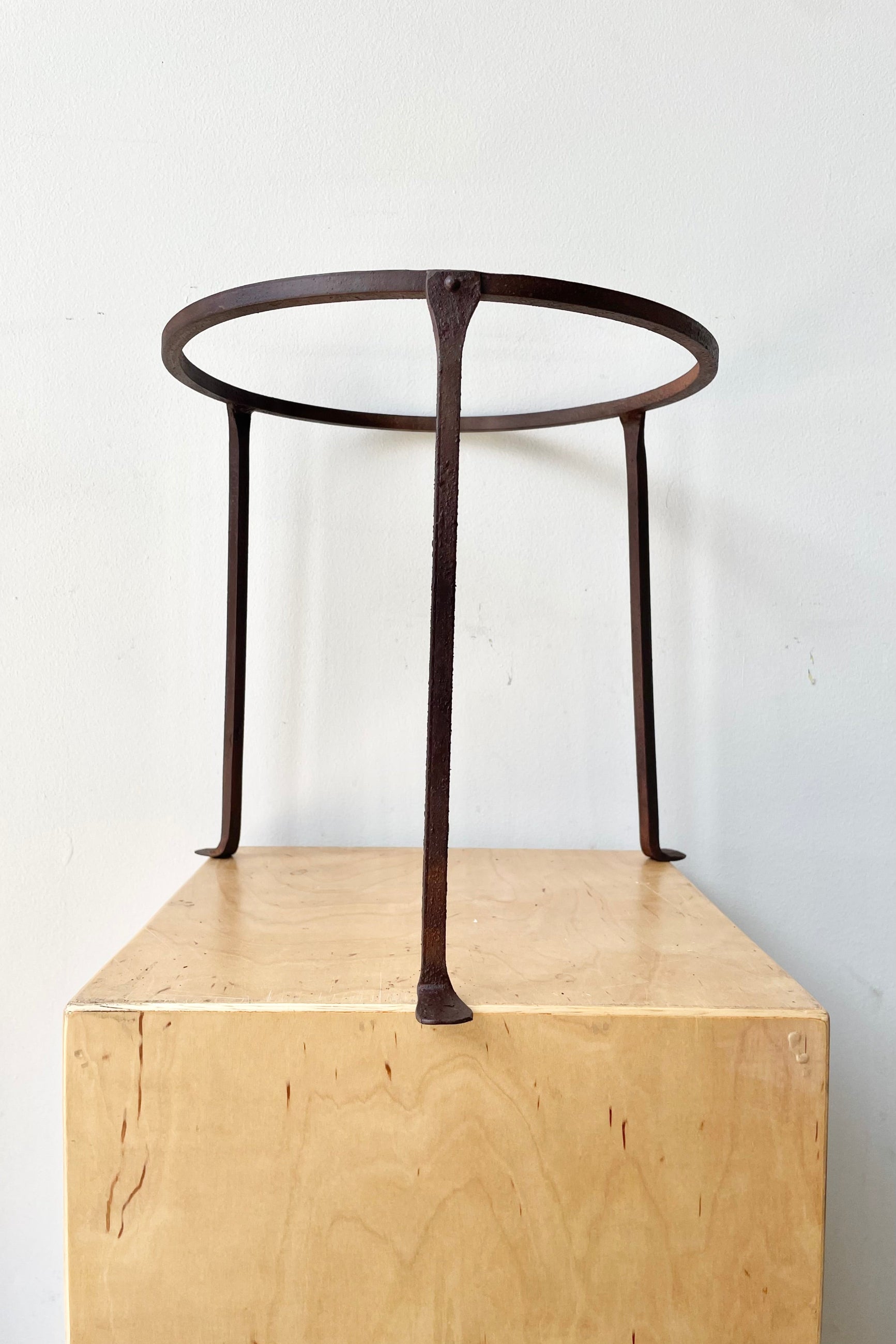 Iron Plant Stand Short 12"H x 12"D against a white wall ©Sprout Home