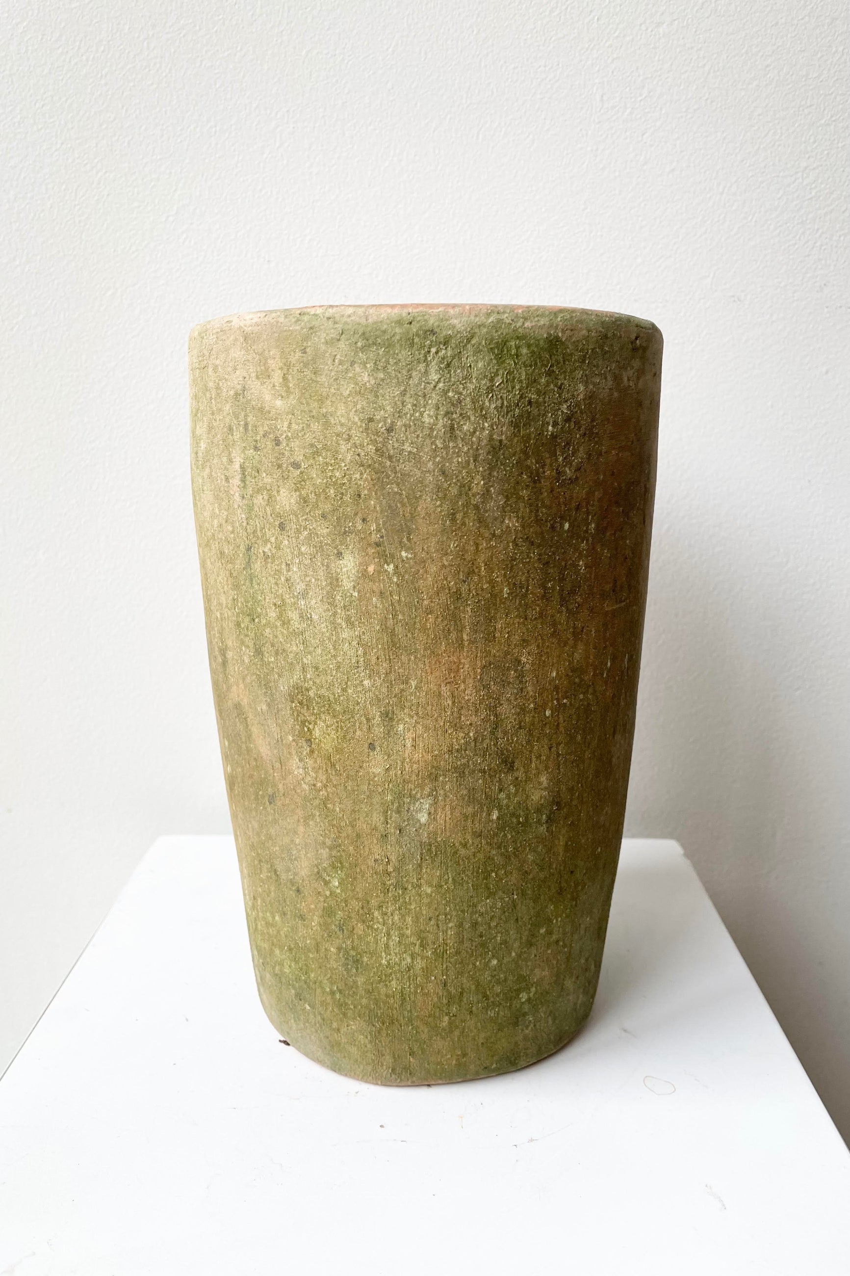 The small Aged Cylinder Planter sits against a white backdrop.  ©Sprout Home