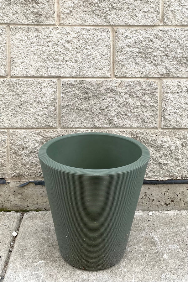 A frontal full view of Madison Olive Planter 14" against concrete backdrop