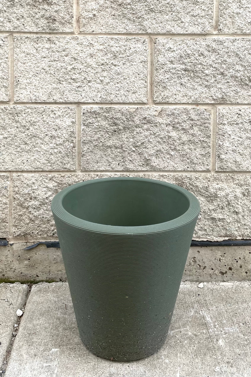 A frontal full view of Madison Olive Planter 14" against concrete backdrop