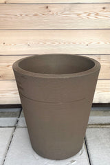 A full view of Madison Mocha Planter 20" against wood backdrop