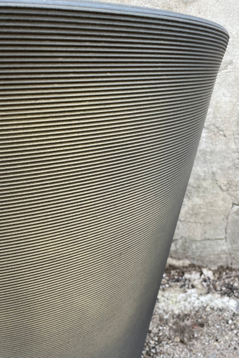 a detail shot of the horizontal banding on the old bronze Madison pot. 
