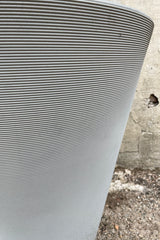 detail picture of the horizontal ridges of the weathered greystone Madison planter. 