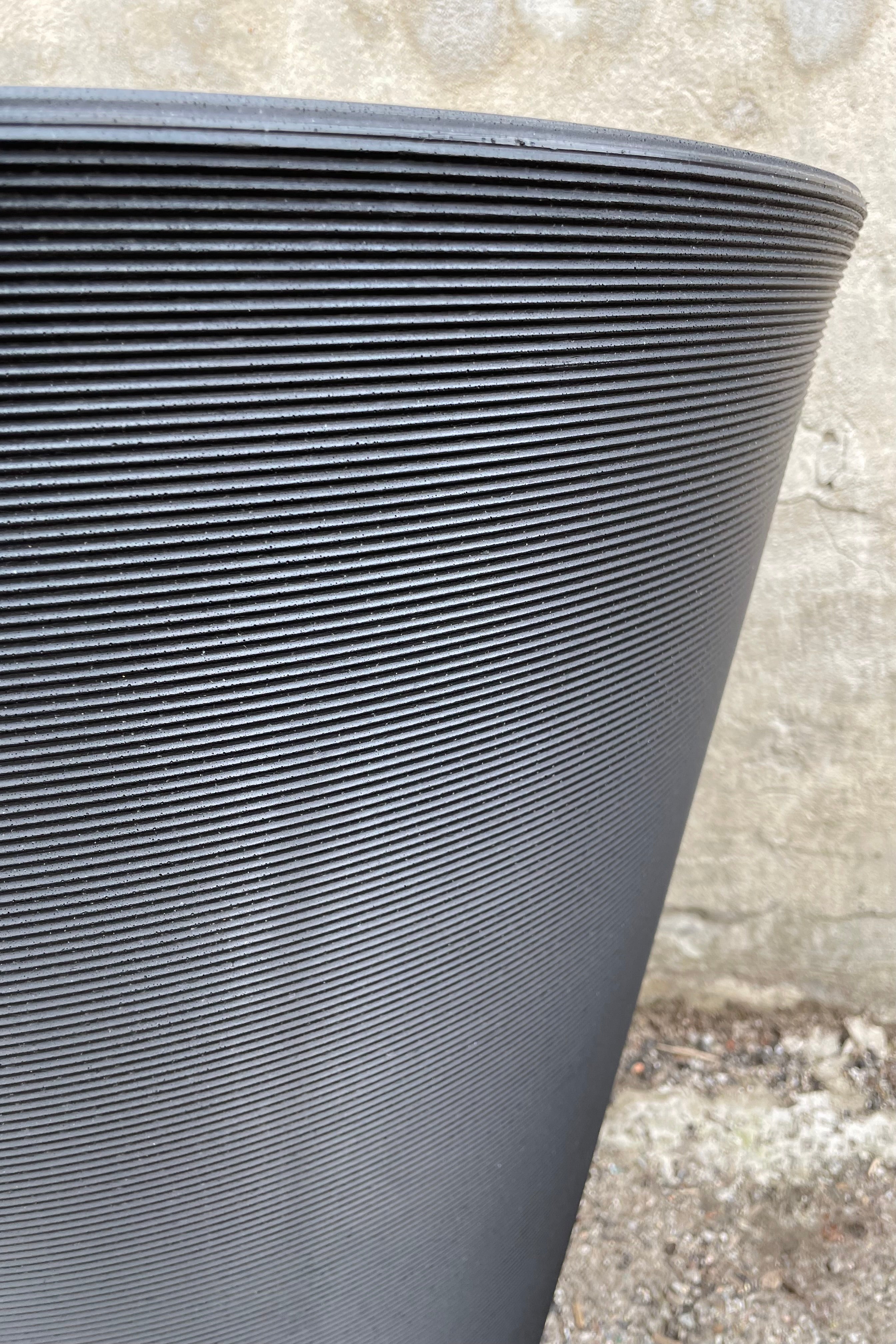 a detail shot of the horizontal ridging on the caviar black madison pot. 