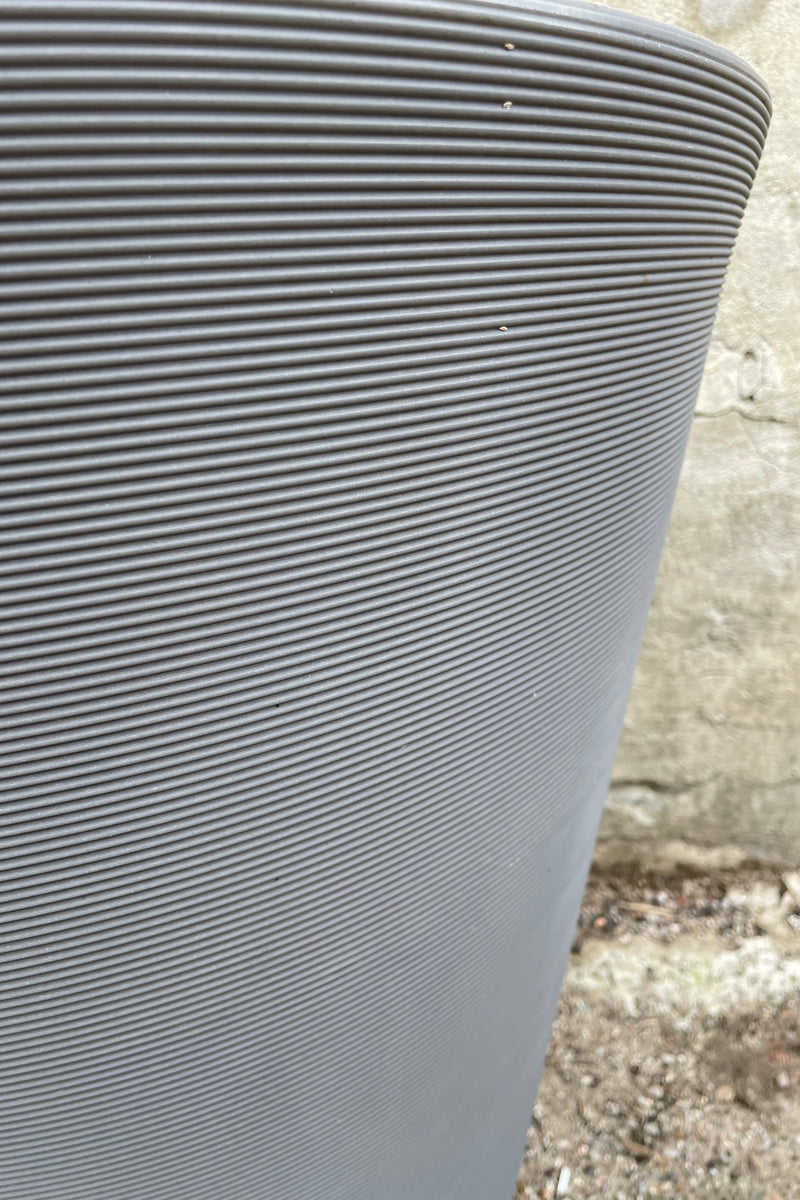 A detail picture of the horizontal ridging of the slate madison planter. 