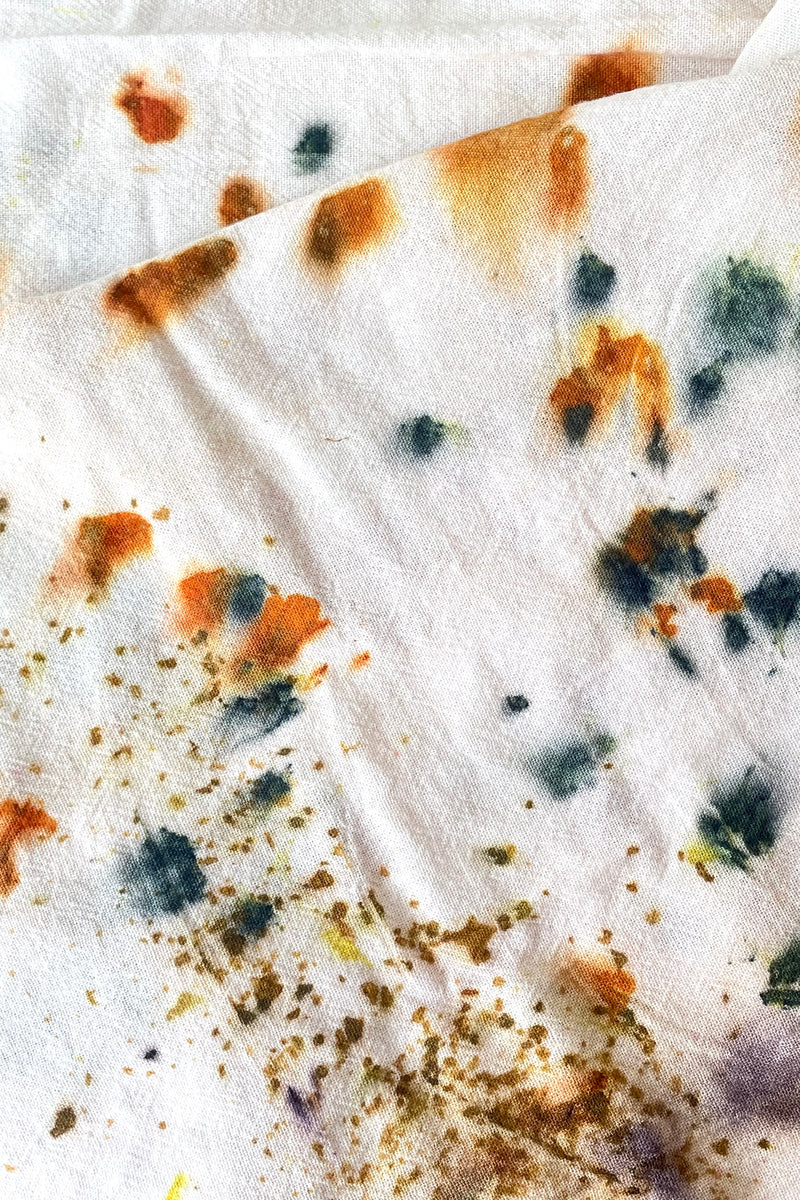 A close-up view of the Botanically Dyed Tea Towel in abstract multi color