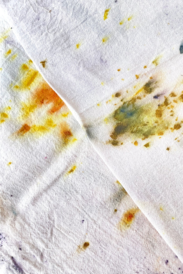 A close-up view of the Botanically Dyed Tea Towel in abstract purple