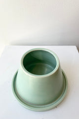 Verdigris Anthony planter against a white wall at Sprout Home.