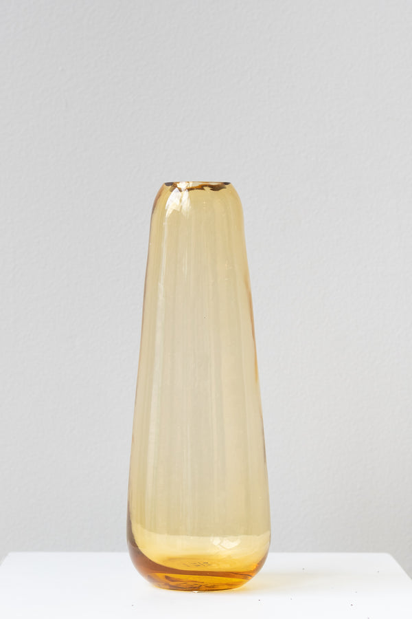 Hawkins New York amber Aurora slim drop vase in front of white background