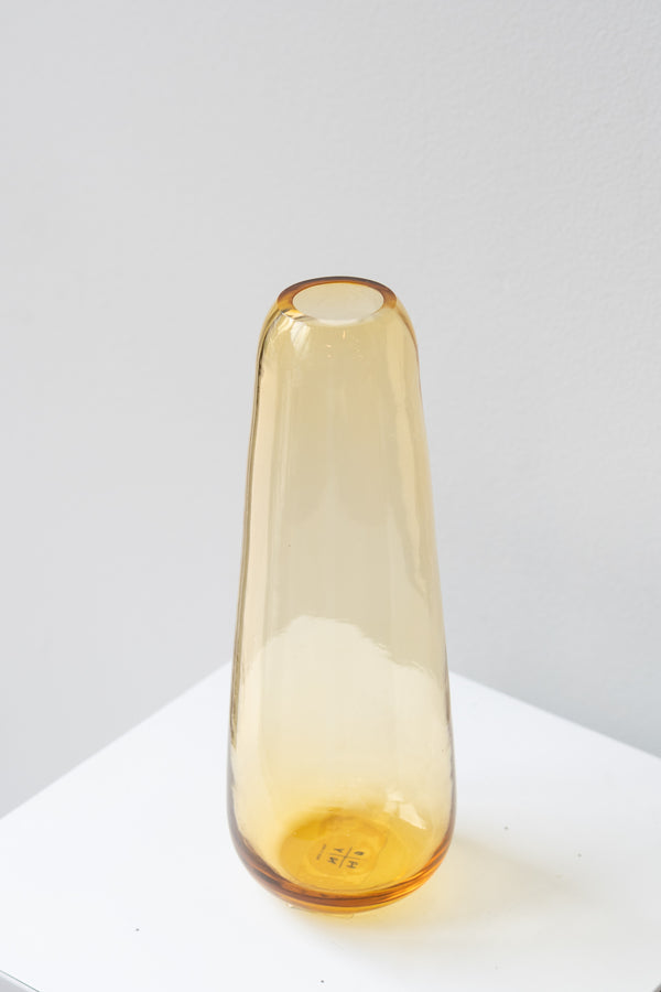 Hawkins New York amber Aurora slim drop vase in front of white background