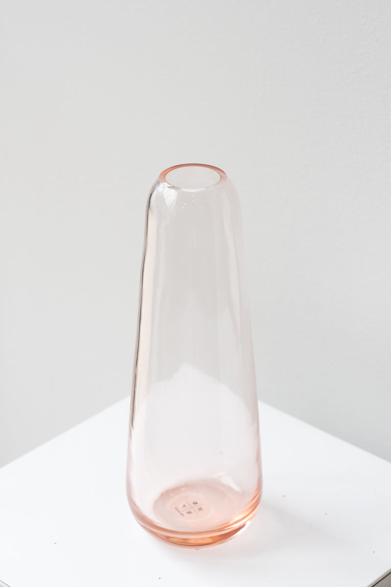 Hawkins New York blush Aurora slim drop vase in front of white background