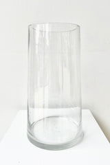 Clear Glass 10"x5" Tapered Round Reverse against a white wall