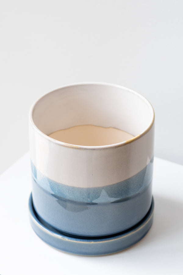 Large Blue layers Minute Pot sits on a white surface in a white room