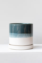 Large Green Blue Minute Pot sits on a white surface in a white room