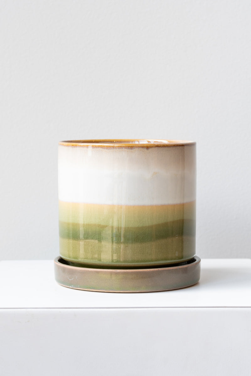Large Green Layers Minute Pot sits on a white surface in a white room
