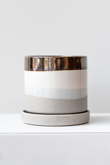 Large Mocha Cement Minute Pot sits on a white surface in a white room