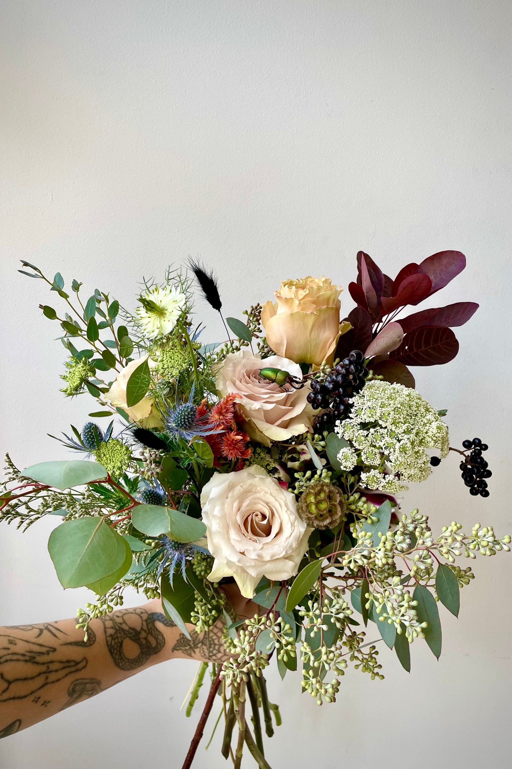 Betelgeuse Arrangement designed by Sprout Home with shades of grey and a beetle on the top. ©Sprout Home #size_$130