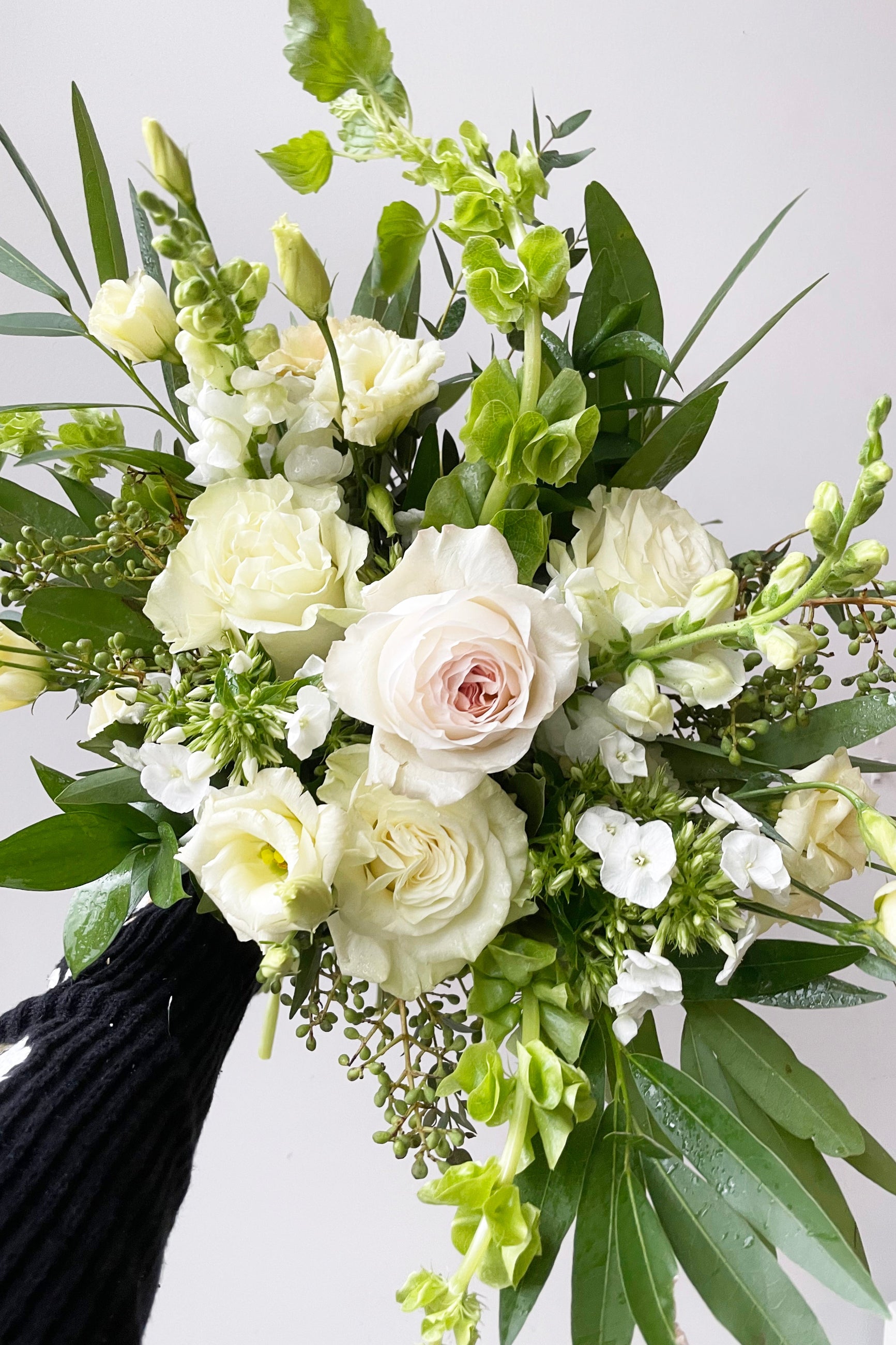 a floral detail of a custom fresh floral arrangement by Sprout Home in shades of white, cream and green ©Sprout Home #size_$75