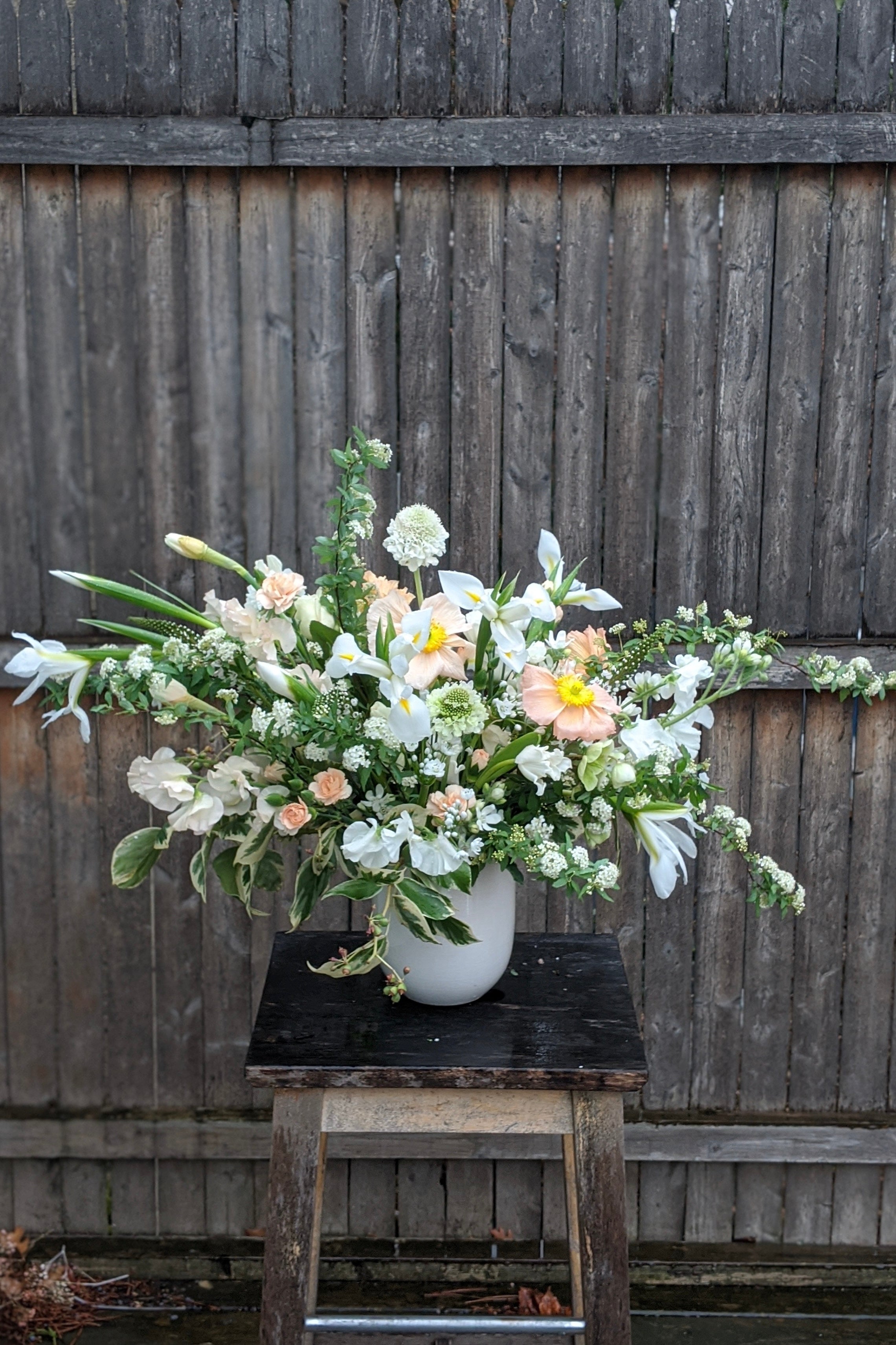 An example of Floral Arrangement Bleached by Sprout Home in Chicago. The arrangement uses primarily white flowers with green foliage. #size_$200