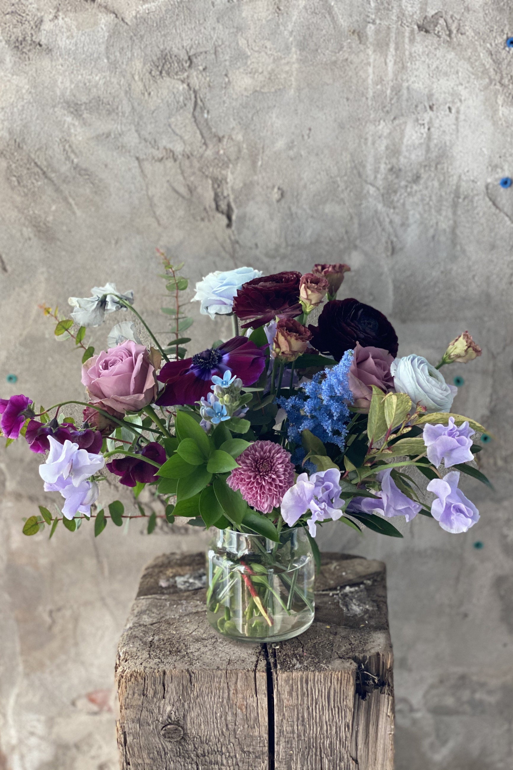 Custom floral arrangement by Sprout Home with shades of blue and purple ©Sprout Home #size_$130