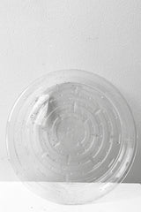 A full overhead view of Plastic saucer 8" against white backdrop