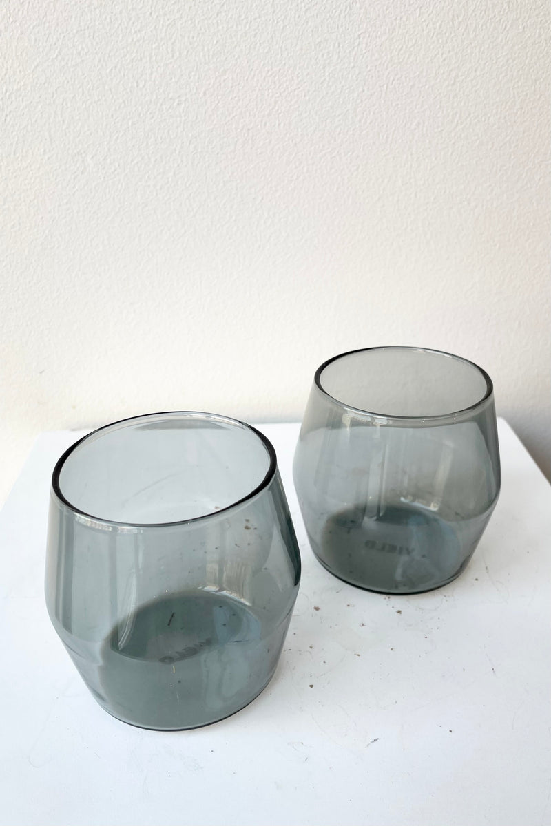 6oz grey century glass pair against a white wall. 