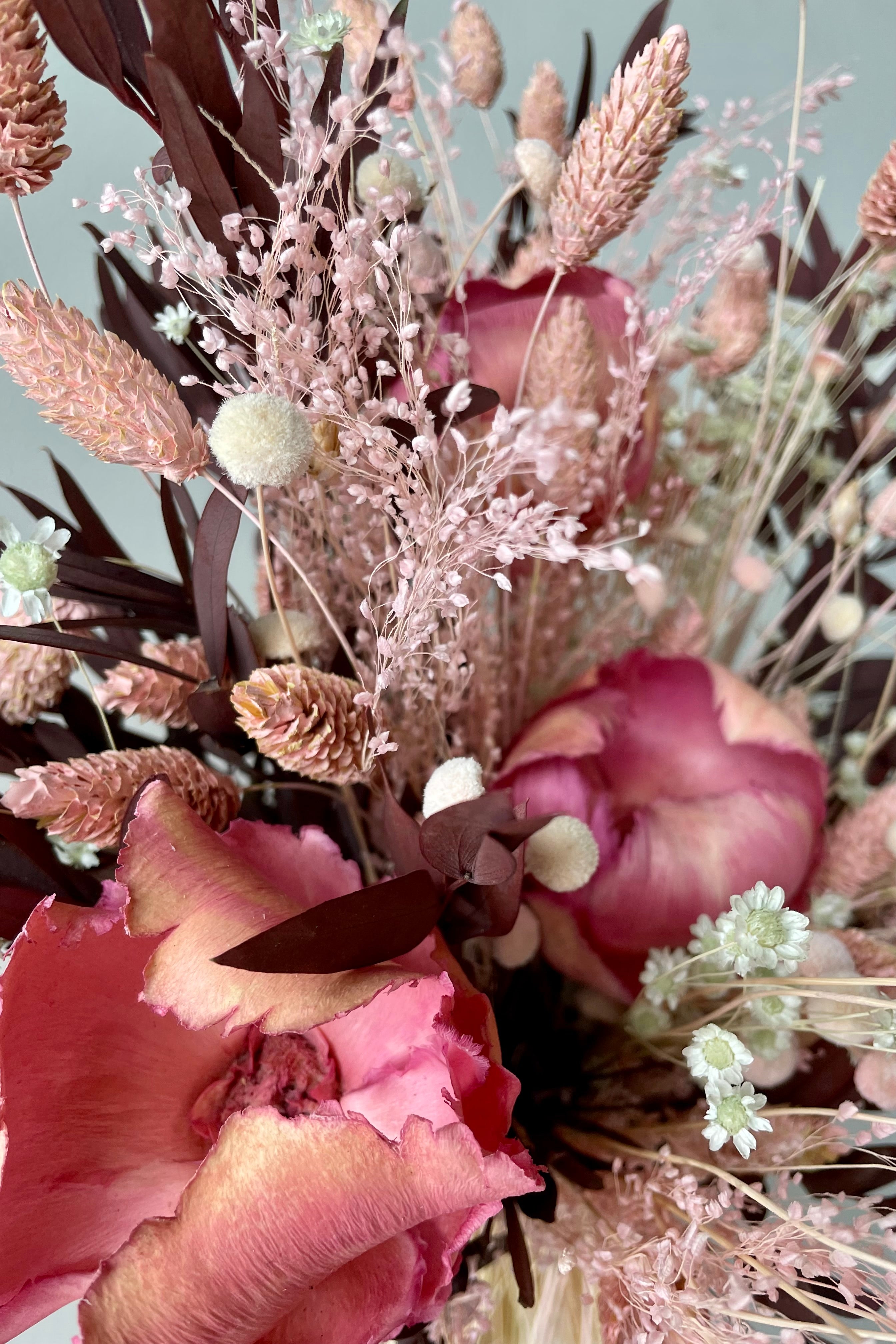 Chocoberry Milkshake preserved arrangement detail pictures showing the shades of pink flowers and chocolate foliage. #size_$125