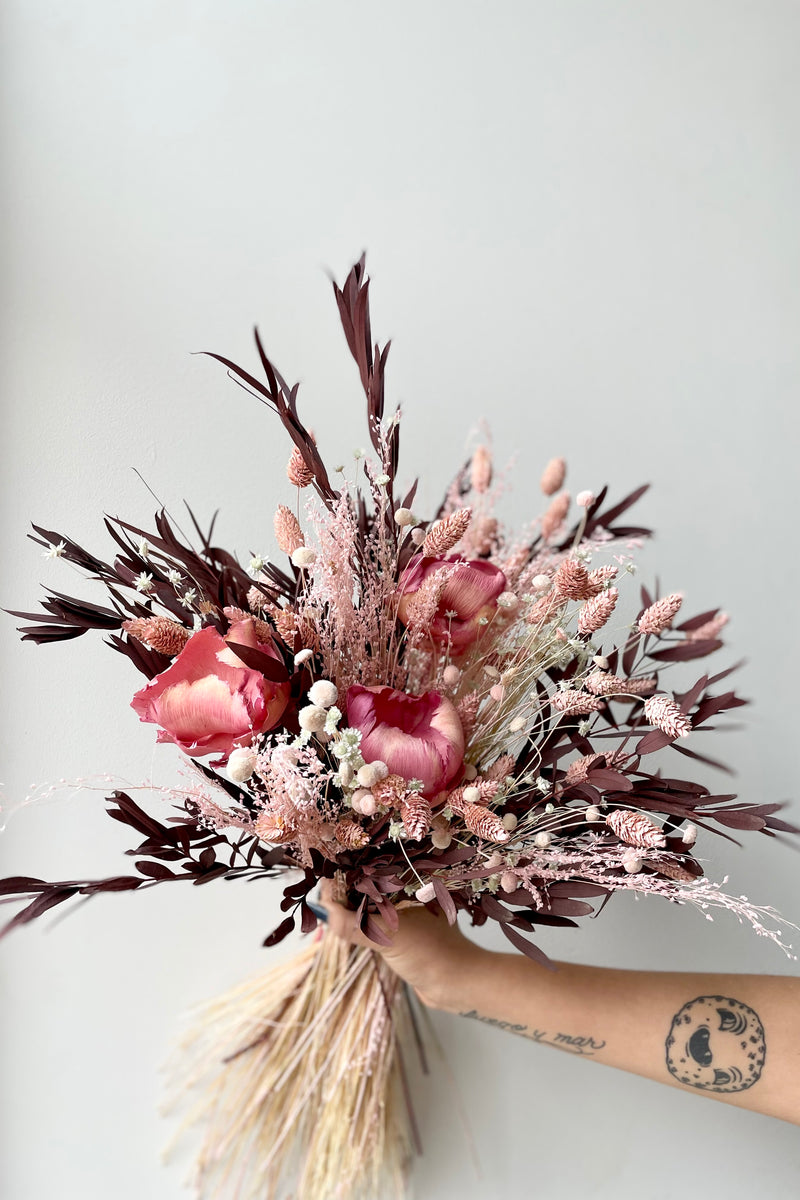 Sprout Home's Chocoberry Milkshake preserved arrangement against a white wall. 