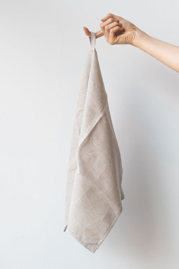 Civil Alchemy Natural linen towel held in front of white background