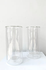 A frontal view of the set of 2 Clear Double Wall Glass in 16 oz against a white backdrop