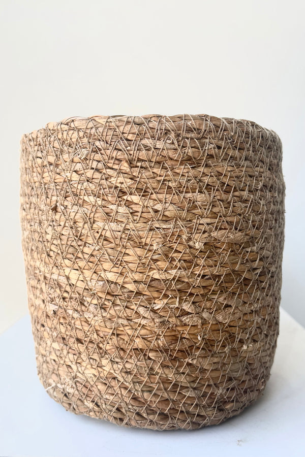 A close view of Seagrass Basket with liner 4.75" against white backdrop