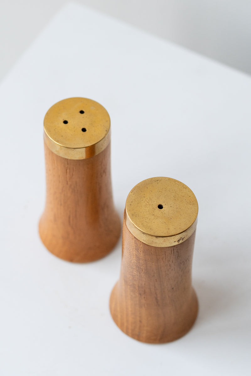 Gold & Wood Salt and Pepper Shakers on a white surface in a white room