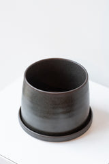 Kinto porcelain pot small black on white surface in white room