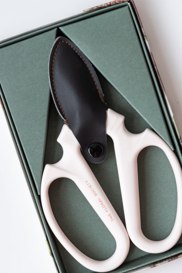 The Floral Society floral clippers on a white surface