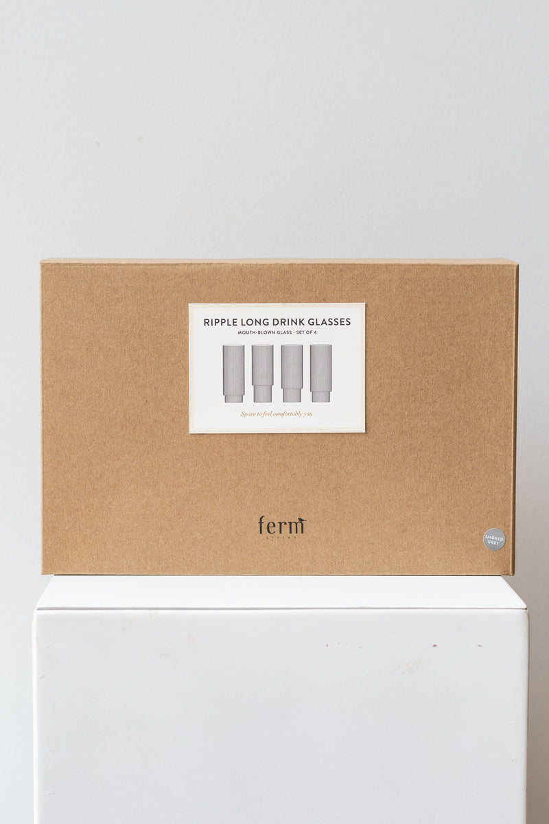 Box for Ferm Living Ripple Long Drink Glasses Set of 4 glass smoke on a white surface in a white room