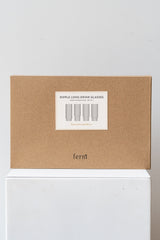 Box for Ferm Living Ripple Long Drink Glasses Set of 4 glass clear on a white surface in a white room