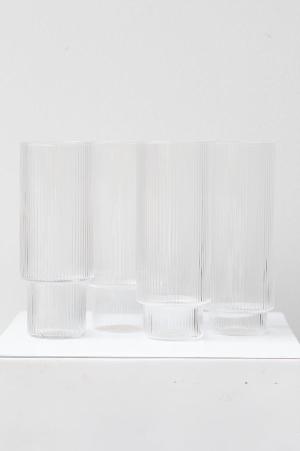 Ferm Living Ripple Long Drink Glasses Set of 4 glass clear on a white surface in a white room