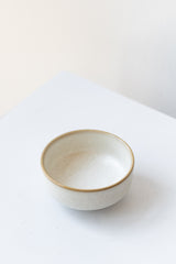 Cream-colored ceramic Sekki salt jar by Ferm Living in front of white background