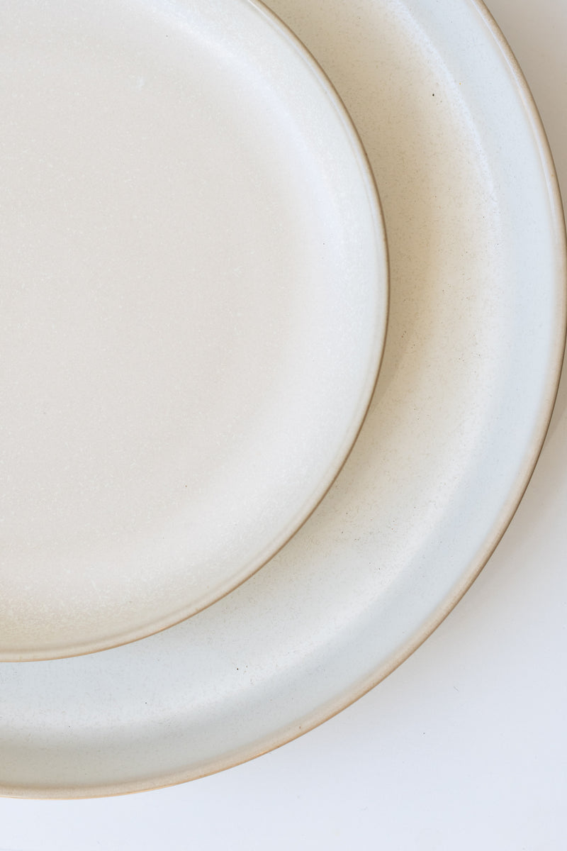 Close up of Ferm Living cream Sekki plates from above