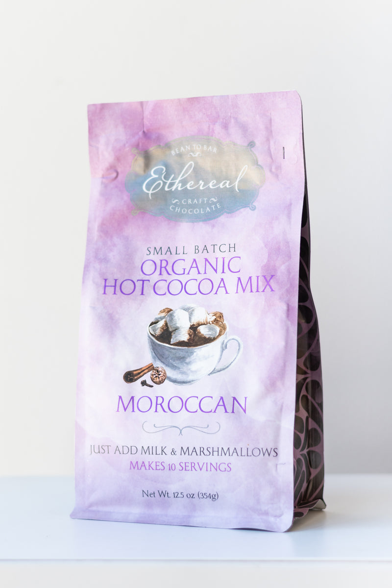 Ethereal Chocolate Moroccan hot chocolate mix bag on a white surface in a white room