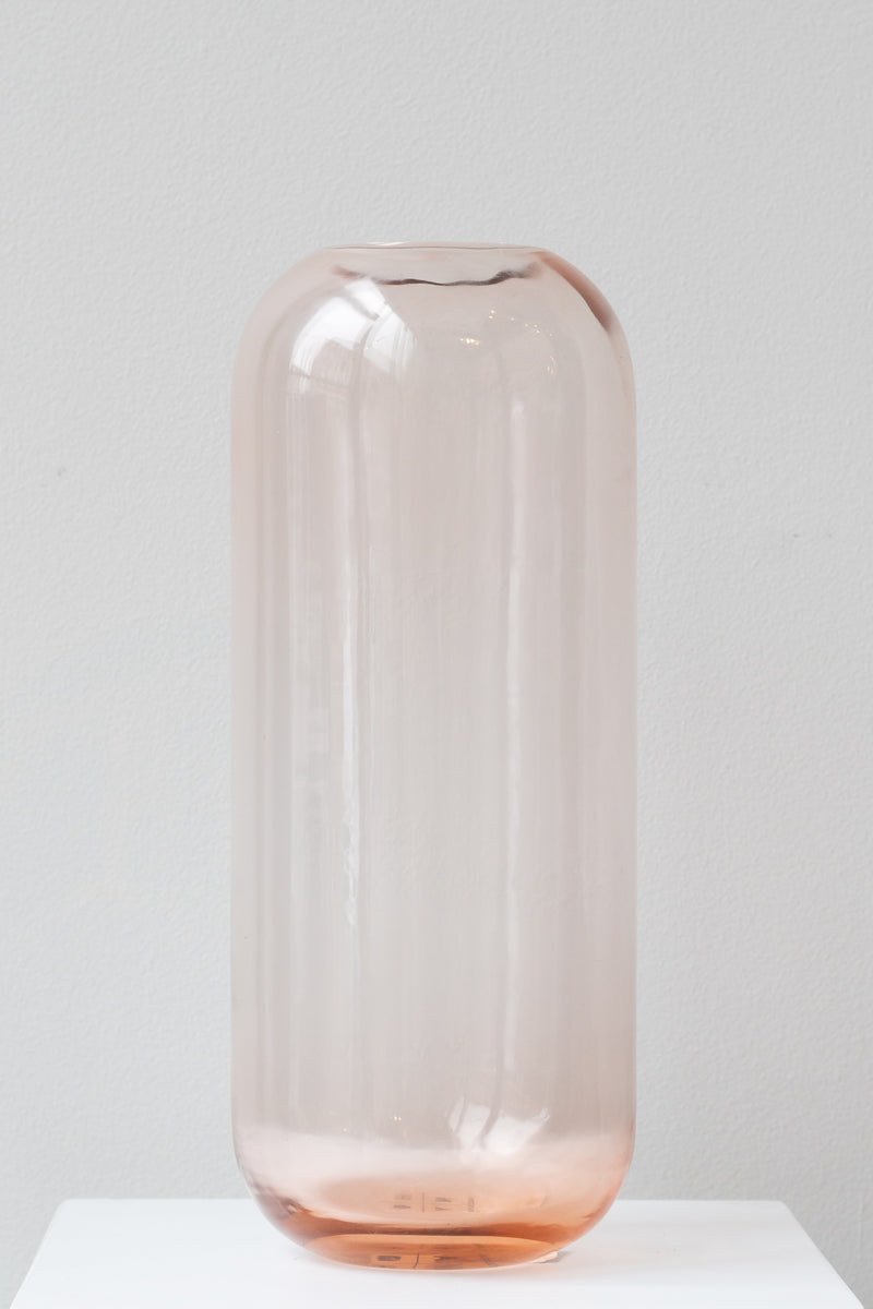 Hawkins New York large blush Aurora Pill Vase on white surface in front of white background