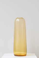 Hawkins New York small amber Aurora Pill Vase on white surface in front of white background