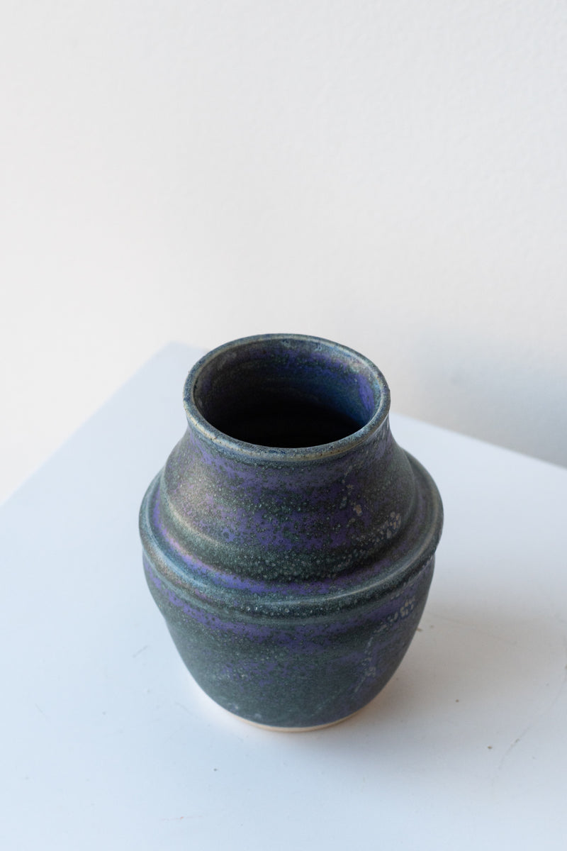 Shared Table Pottery indigo honey vase in front of white background
