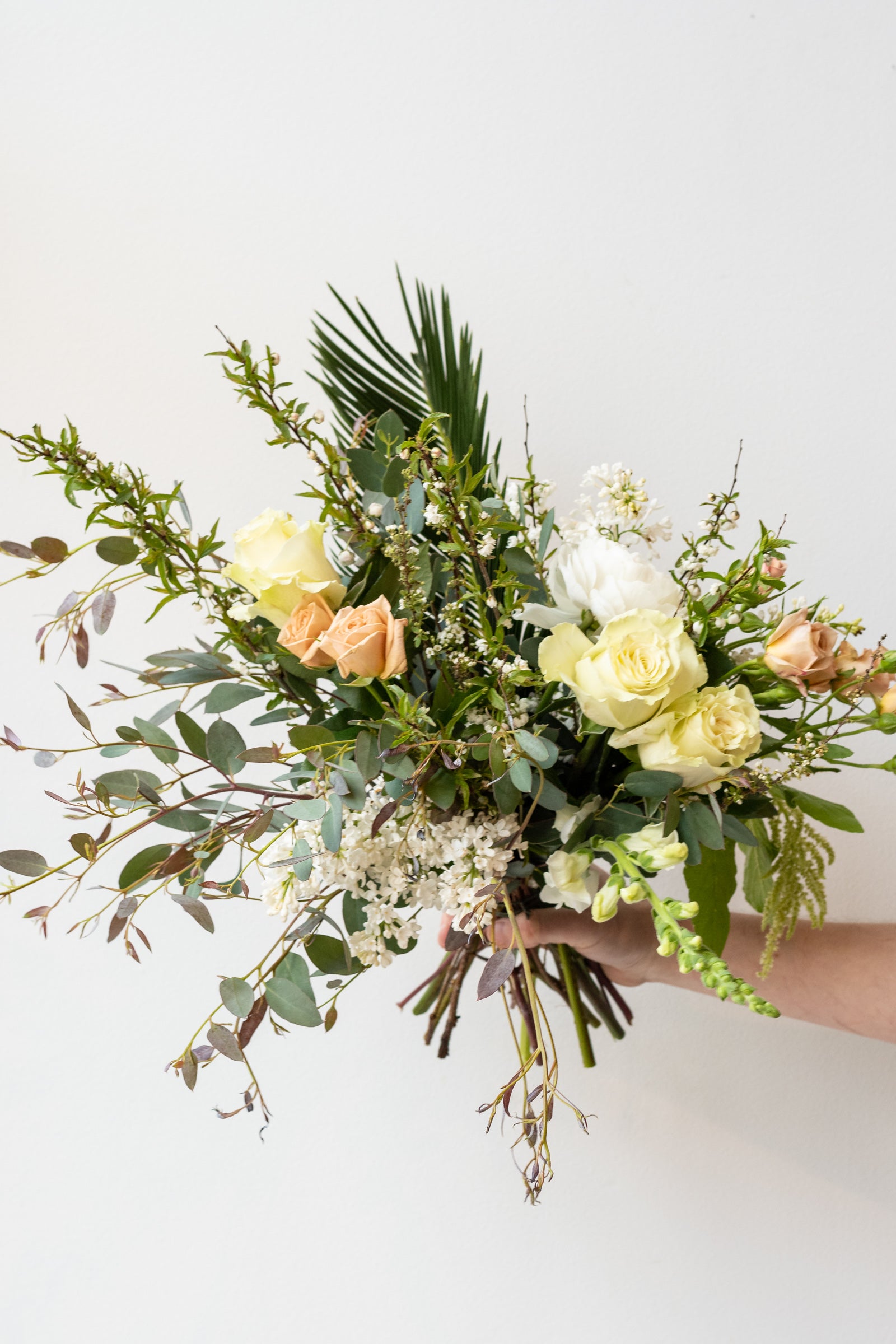 An example of Floral Arrangement Bleached by Sprout Home in Chicago. The arrangement uses primarily white flowers with green foliage. #size_$125